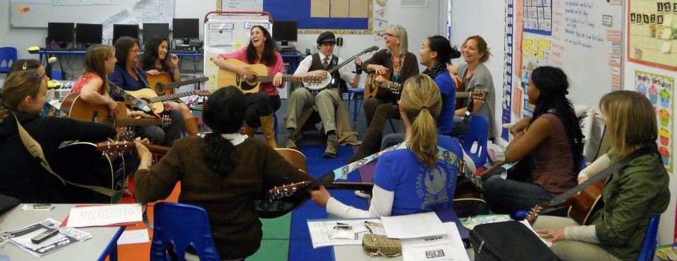 Jessica and her son, Elias Turner are jamming with a group of GITC classroom teachers. Elias is playing bango to her left (Jessica Baron)